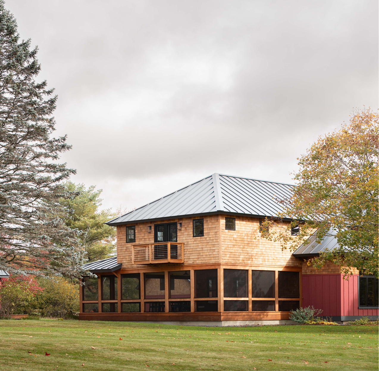 Wide exterior photo of a home on Mauran Lane in Dublin, NH featuring Timber Trading ICON® thermally modified wood.