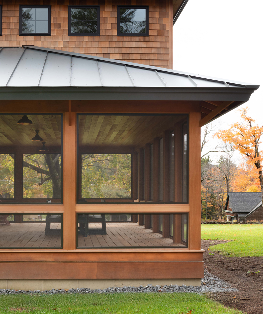 Exterior photo of an enclosed porch on Mauran Lane in Dublin, NH featuring Timber Trading ICON® thermally modified wood.