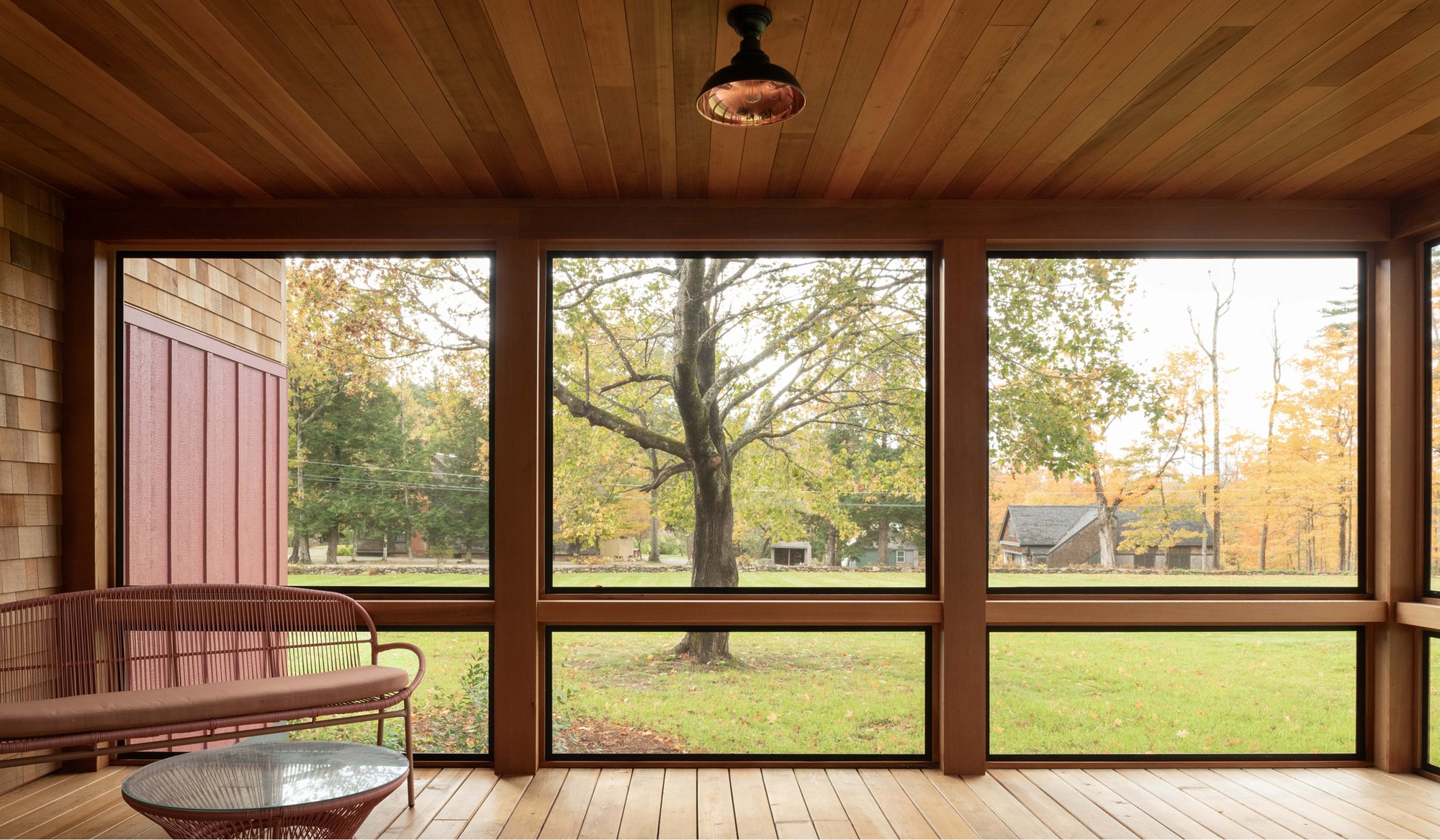 Interior photo of an enclosed porch on Mauran Lane in Dublin, NH featuring Timber Trading ICON® thermally modified wood.