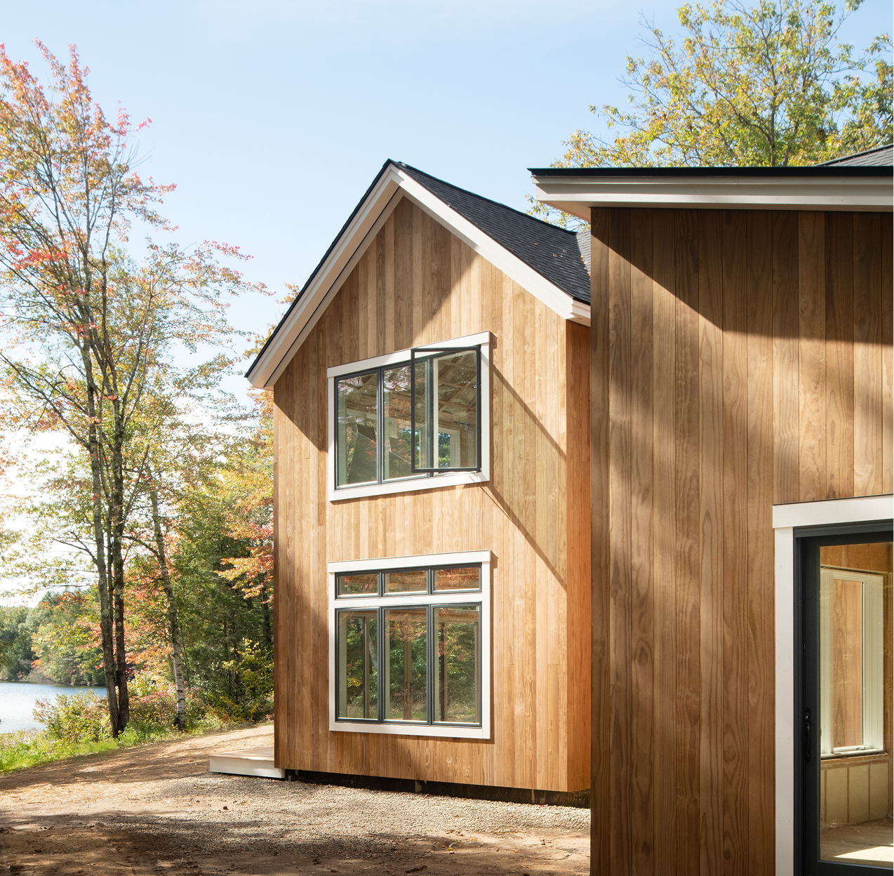 A wide exterior image of a home in Dublin, NH that uses Timber Trading ICON Radiata Pine siding.