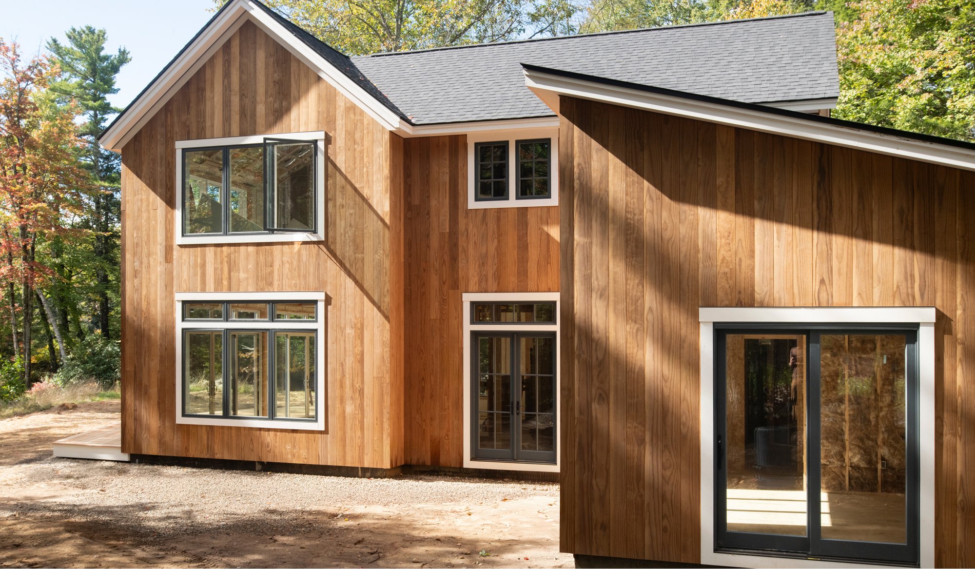 A wide exterior image of a home in Dublin, NH that uses Timber Trading ICON Radiata Pine siding.