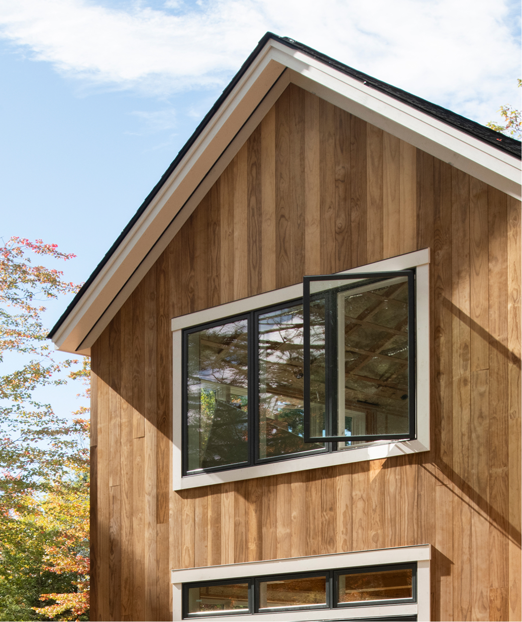 A close up exterior image of a home in Dublin, NH that uses Timber Trading ICON Radiata Pine siding.