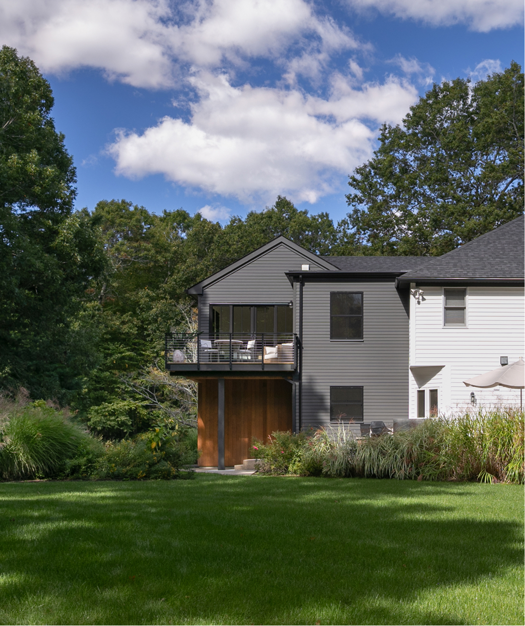 Far away exterior shot of a home in West Greenwich, RI featuring Timber Trading ICON Douglas Fir