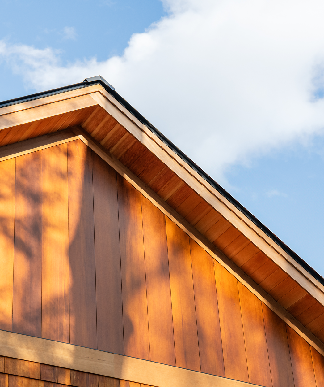 Close up exterior photo of a home on Squam Lake in Center Harbor, NH featuring Timber Trading ICON® thermally modified wood.  