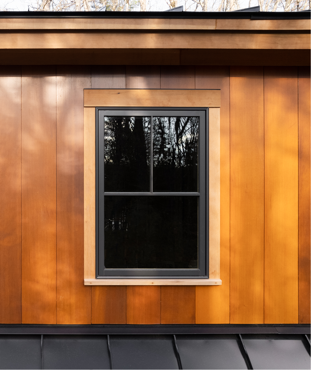 Close up exterior photo of a home on Squam Lake in Center Harbor, NH featuring Timber Trading ICON® thermally modified wood.  