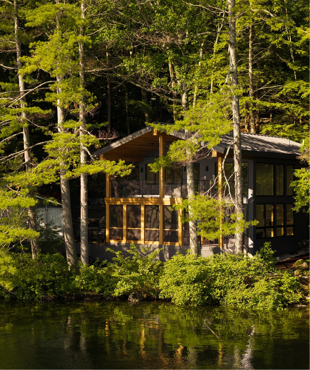 Image of porch ceiling, soffit, and wrapped beams on a modern home along Little Lake Sunapee, NH