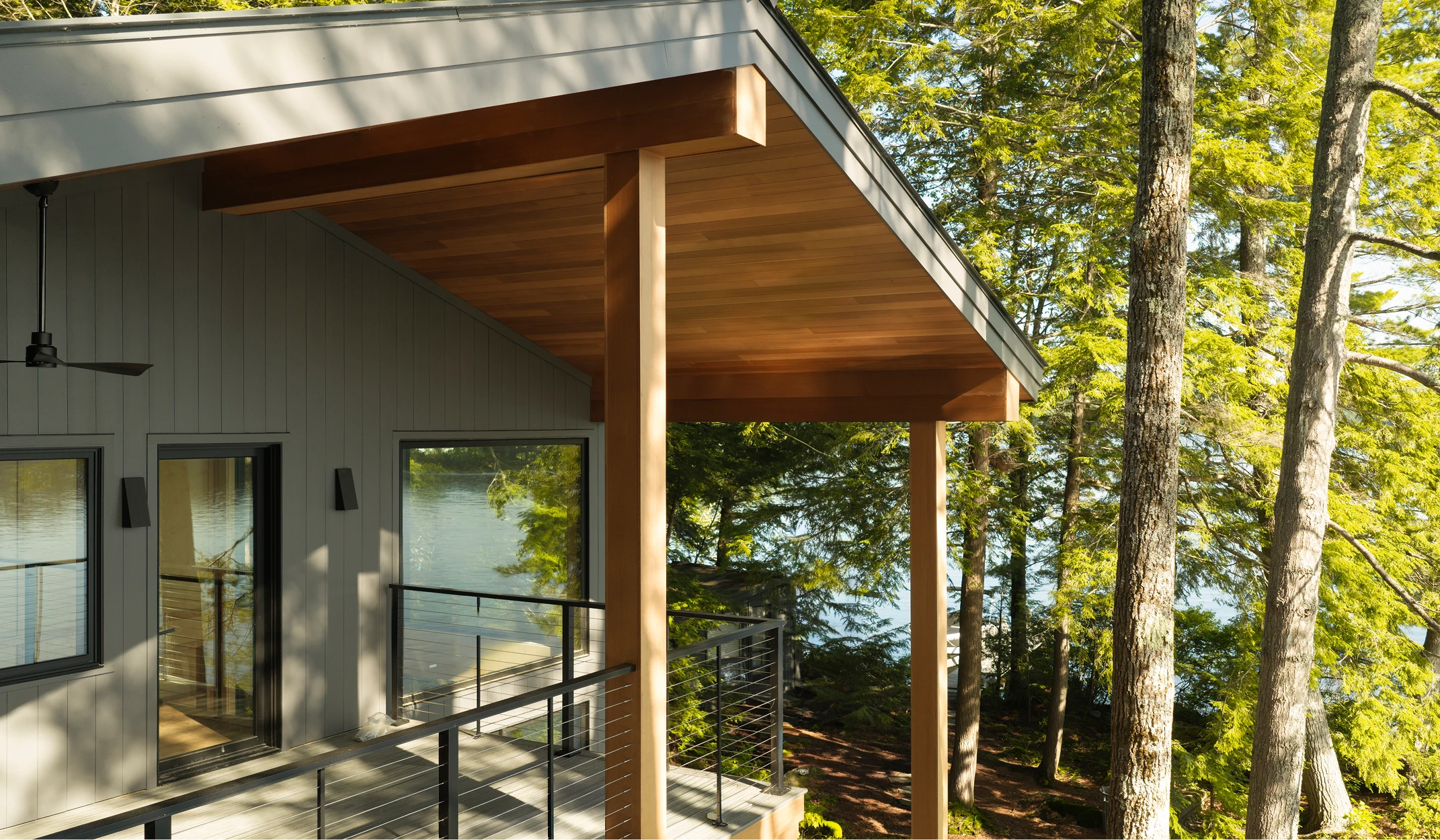 Image of porch ceiling, soffit, and wrapped beams on a modern home along Little Lake Sunapee, NH