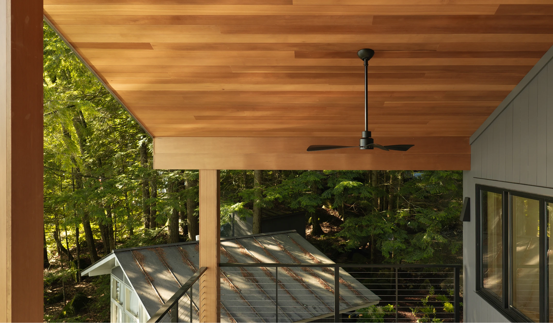 Image of porch ceiling, soffit, and wrapped beams on a modern home along Little Lake Sunapee, NH
