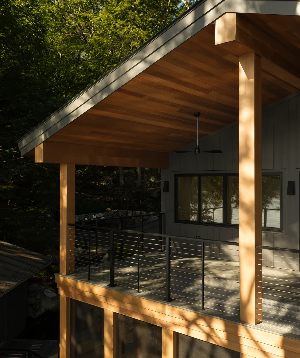 Image of porch ceiling, soffit, and wrapped beams on a modern home along Little Lake Sunapee, NH